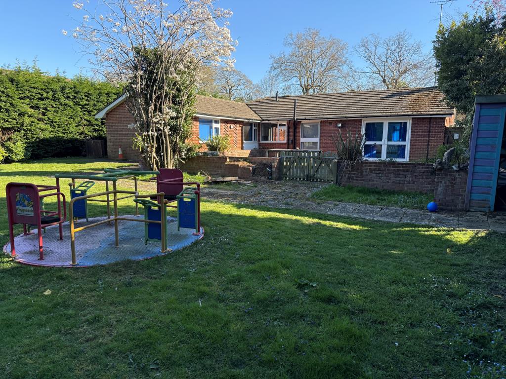 Lot: 87 - FORMER NHS PREMISES WITH POTENTIAL FOR DEVELOPMENT - Rear of property with children's play area